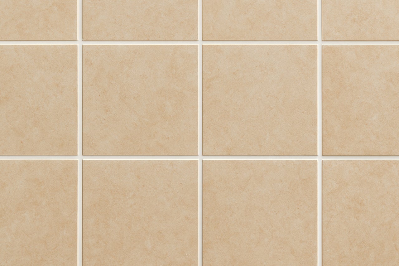 Beige wandtegels met voegen