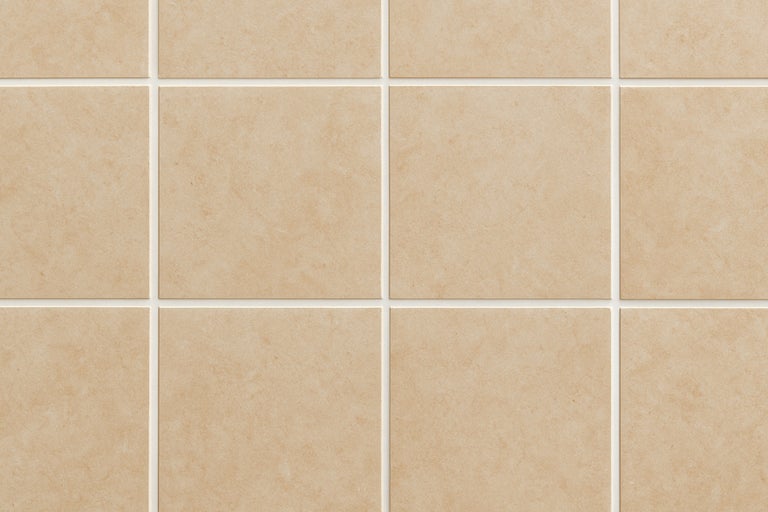 Beige wandtegels met voegen