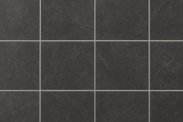 Close-up van vloertegels met steenlook en voegen