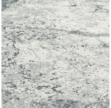 Detailweergave van een vloerkleed met abstract patroon