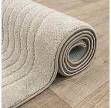Opgeloste vloerkleed met gestreept patroon