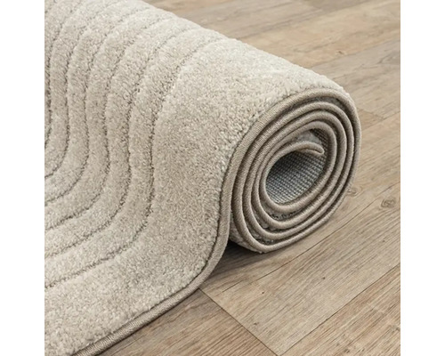 Opgeloste vloerkleed met gestreept patroon
