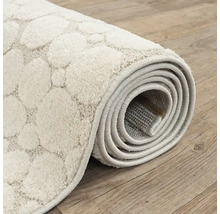 Opgerolde vloerkleed met stippenpatroon