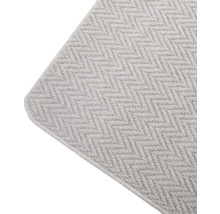 Detailweergave van een vloerkleed met visgraatmotief