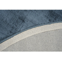 Detailopname van een blauw tapijt met textielpatroon