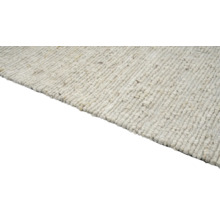 Detailweergave van een geweven vloerkleed van natuurlijke vezels
