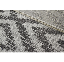 Detail van een geweven tapijt met geometrisch patroon