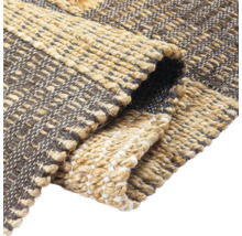 Detailopname van een jute vloerkleed met patroon