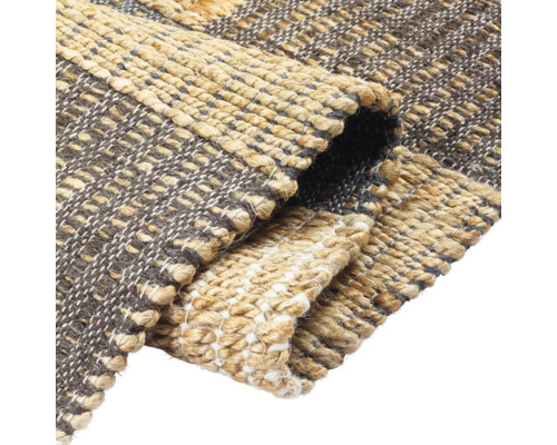 Detailopname van een jute vloerkleed met patroon