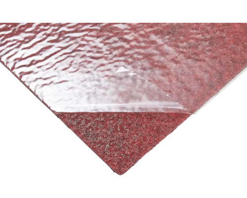 Rood zelfklevend afdekvlies met deels losgetrokken transparante folie.