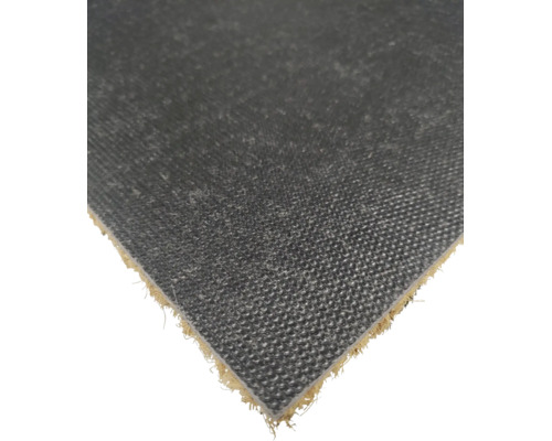 Detailopname van de antislip achterzijde van een kokosmat met een gestructureerd oppervlak.
