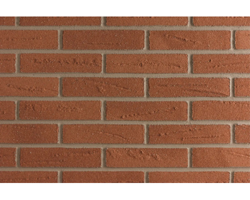 Gestructureerde bakstenen muur in klassiek metselverband.