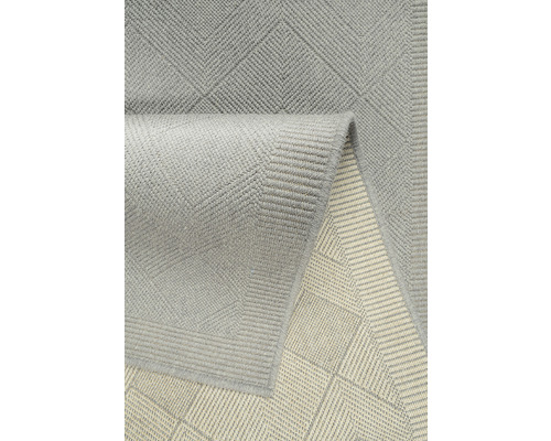 Grijs tapijt met geometrisch patroon
