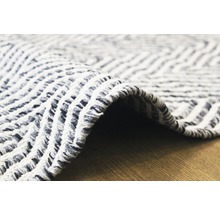 Close-up van een vloerkleed met geometrisch patroon