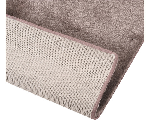 Tapijt met textieloppervlak en geweven achterkant
