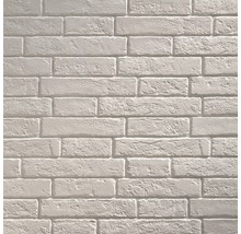 Lichte bakstenen muur als achtergrond voor bouwprojecten