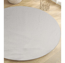 Rond vloerkleed op houten vloer