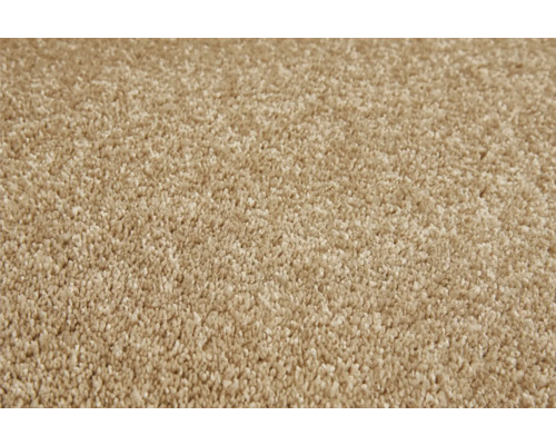 Close-up van een beige tapijt.
