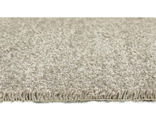 Close-up van een beige vloerkleed met hoogpolig