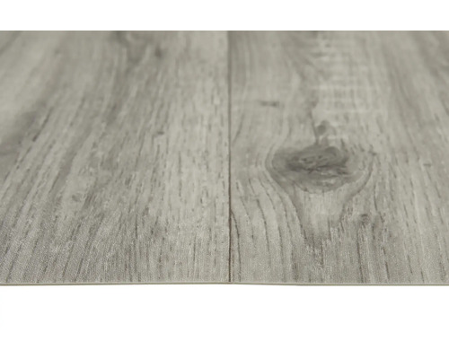 Close-up van een grijze vinylvloer met houtlook.