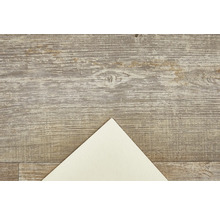 Decoratieve plaat met houten structuur en een lichte papieren hoek