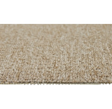Close-up van een beige tapijt.