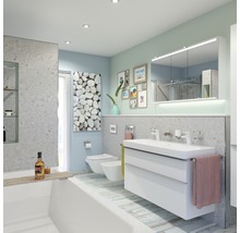 Lichte badkamer met bad, wastafelonderkast, toilet en bidet in een modern design.