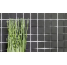 Decoratieve kunstplant voor een wand van tegels