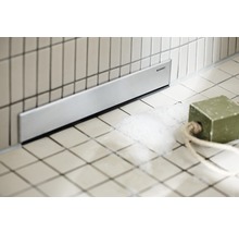Inloopdouchegoot met Geberit logo in de badkamer.