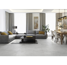 Woonkamer met grijze hoekbank, salontafel, eettafel en stoelen