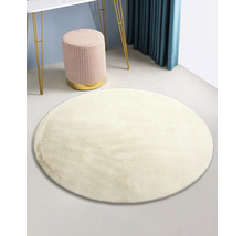 Rond tapijt in kamer met kruk en tafel