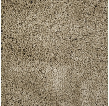 Close-up van een beige hoogpolig tapijt