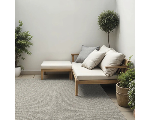 Buitenruimte met tapijt, zitmeubel en planten