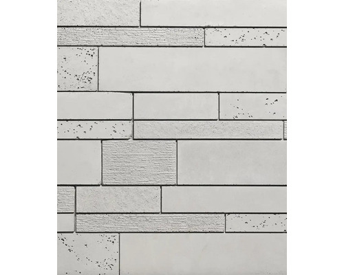 Close-up van een wandbekleding van beton met verschillende texturen en afmetingen