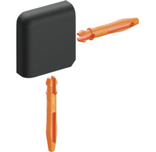 Meubelverbinderset met een zwart hoekstuk en twee oranje spreidpluggen van kunststof.