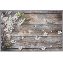 Deurmat met houten planken en bloemmotieven