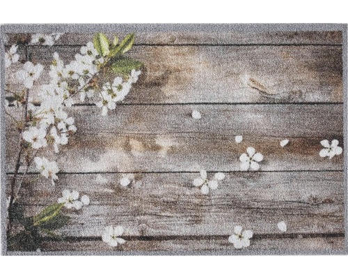 Deurmat met houten planken en bloemmotieven