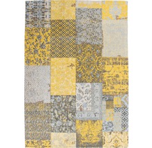 Tapijt in patchworkdesign met geometrische en florale motieven