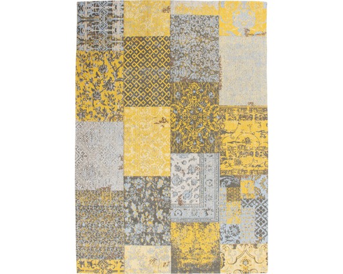 Tapijt in patchworkdesign met geometrische en florale motieven
