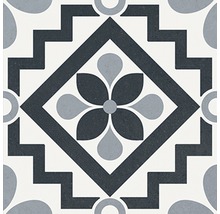 Decoratieve vloertegel met bloemmotief en geometrische elementen