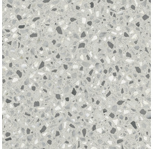 Close-up van een vloertegel in terrazzo-design met diverse steenslag