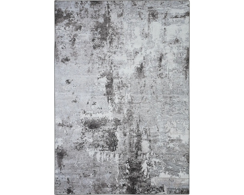 Tapijt met abstract patroon in verschillende grijstinten.
