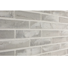 Close-up van een muur met baksteenmotief