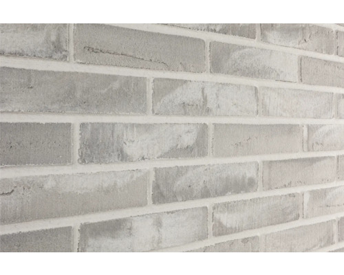 Close-up van een muur met baksteenmotief