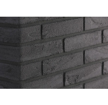Close-up van een zwarte bakstenen muur