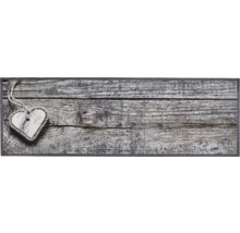 Decoratieve houten hart hanglamp op houten achtergrond