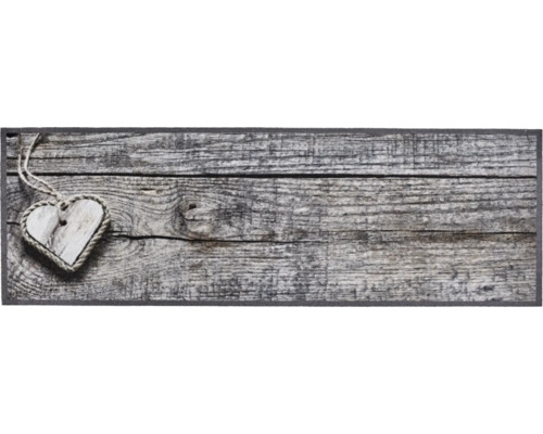 Decoratieve houten hart hanglamp op houten achtergrond